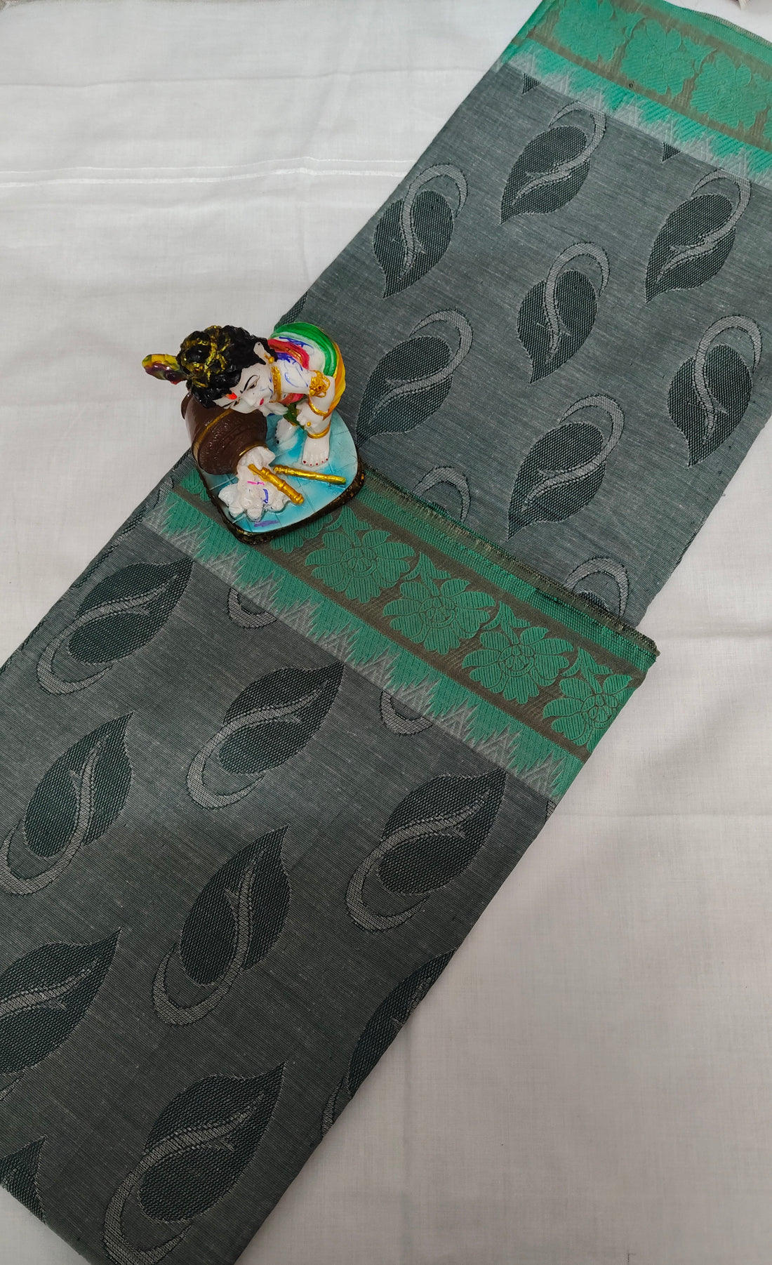 Nagamam Empose Cotton Saree with Leaf Motifs and Green Border